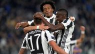 Juventus’ Mario Mandzukic celebrates scoring their first goal with Blaise Matuidi and Juan Cuadrado REUTERS/Massimo Pinca
