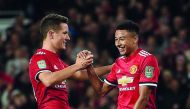 Manchester United midfielder Jesse Lingard (right) celebrates scoring his team’s third goal during the English League Cup third round match against Burton Albion at Old Trafford in Manchester on Wednesday.
