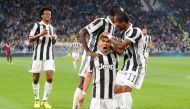 Juventus’ Paulo Dybala celebrates scoring their first goal with Blaise Matuidi, Douglas Costa and Juan Cuadrado REUTERS/Massimo Pinca 