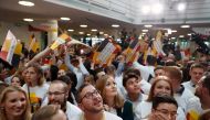 Supporters of the Christian Democratic Union (CDU) watch as exit poll results were broadcasted on public television at an election night event at the party's headquarters in Berlin during the general election on September 24, 2017. AFP / Odd Andersen