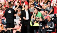Manchester United manager Jose Mourinho is sent to the stands by referee Craig Pawson (not pictured) as fourth official Mike Jones looks on REUTERS/Dylan Martinez 
