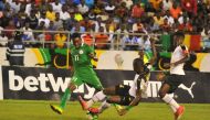 Samuel Sarfo of Ghana in action against Rabiu Ali of Nigeria during the Western African Football League final match between Ghana and Nigeria at the Cape Coast stadium in Ghana on September 24, 2017.

( Stringer - Anadolu Agency )
