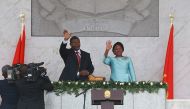 Sworn in Angolan President Joao Lourenco (L) and his wife Ana Dias de Lourenco wave to the crowd at the end of his swearing in ceremony as the new Angolan President on September 26, 2017 in Luanda.  AFP / Ampe Rogerio