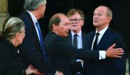 Nestle CEO Paul Bulcke (3rdL) talks with L'Oreal Chairman Jean-Paul Agon (R) as they leave after attending the funeral of L'Oreal heiress, Liliane Bettencourt, on September 26, 2017 at the Saint-Pierre church in Neuilly-sur-Seine, near Paris. Bettencourt,