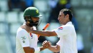 Pakistan captain Misbah ul Haq (left) is greeted by team-mate and fellow retiree Younis Khan on the fourth day’s play of the final Test match against the West Indies at the Windsor Park Stadium in Roseau, Dominica in this May 2017 file photo.