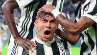 Juventus’ Paulo Dybala celebrates after scoring their first goal against Torino in their Serie A match at Juventus Stadium on Saturday.
