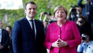 German Chancellor Angela Merkel and French President Emmanuel Macron arrive at a ceremony at the Chancellery in Berlin, Germany, May 15, 2017. Reuters/Fabrizio Bensch 