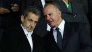 Former French President Nicolas Sarkozy (L) and former German football player and Bayern Munich CEO Karl-Heinz Rummenigge (R) attend during the UEFA Champions League Group B match between Paris Saint-Germain (PSG) and Bayern Munich at Parc des Princes Sta
