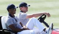 Captain's assistant Tiger Woods of the U.S. Team and Captain Steve Stricker of the U.S. Team ride in a cart during practice rounds prior to the Presidents Cup at Liberty National Golf Club on September 27, 2017 in Jersey City, New Jersey. Sam Greenwood/Ge