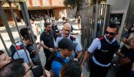 Catalan police officers 'Mossos d'Esquadra' try stop pro-referendum people from going into 'Escola Collaso i Gil' school on September 29, 2017 in Barcelona. Pro-separatist Catalans occupied several schools in Barcelona today which are designated to be pol