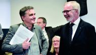 European Investment Bank (EIB) President Werner Hoyer (R) speaks with Greek finance minister, Euclid Tsakalotos during the inauguration of the EIB offices in Athens on September 29, 2017. AFP / Louisa Gouliamaki