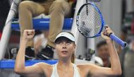 Maria Sharapova of Russia celebrates after winning her match against Anastasija Sevastova of Latvia at the China Open tennis tournament in Beijing on September 30, 2017. (AFP / GREG BAKER)