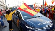 Demonstrators wave Spanish flags and support police during a demonstration in favor of a unified Spain on the day of a banned independence referendum in Catalonia, in Madrid, Spain, October 1, 2017. REUTERS/Rafael Marchante