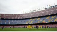 General view as Barcelona’s Lionel Messi prepares to take a freekick in the empty stadium as the game is played behind closed doors. REUTERS/Albert Gea