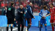 Bayern Munich's French interim head coach Willy Sagnol argues with the fourth offical during the German first division Bundesliga football match between Hertha Berlin and FC Bayern Munich in Berlin, on October 1, 2017. AFP / Odd ANDERSEN