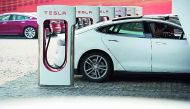 This picture taken on March 17, 2015 shows a Tesla Model S being charged at a car dealership in Shanghai. Johannes Eisele/AFP/Getty Images