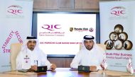 Salem Al Mannai (right), Deputy Group President and CEO, QIC Mena, with Khaled Al Remithi, Porsche Qatar Club President at the signing ceremony.