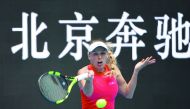 Caroline Wozniacki of Denmark hits a return during her women’s singles match against Wang Qiang of China at the China Open in Beijing yesterday. 