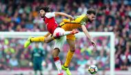 Arsenal midfielder Mohamed Elneny (left) vies with Brighton’s midfielder Davy Propper during the English Premier League match at the Emirates Stadium in London, yesterday.
