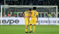 Juventus’ Juan Cuadrado with Paulo Dybala, who looks dejected, at the end of the match REUTERS/Massimo Pinca

