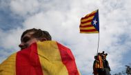 People wave an Estelada (Catalan separatist flag) during a protest one day after the banned independence referendum in Barcelona, Spain October 2, 2017. REUTERS/Susana Vera