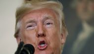 U.S. President Donald Trump makes a statement on the mass shooting in Las Vegas in front of a portrait of President George Washington in the Diplomatic Room at the White House in Washington, U.S., October 2, 2017. REUTERS/Kevin Lamarque