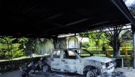 A file picture of a burnt car in a building at the US Consulate in Benghazi, Libya.