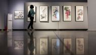 A visitor looks at works by North Korean artists at the Mansudae Art Museum in the 798 art district in Beijing, China, September 20, 2017. Thomas Peter / REUTERS