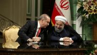 A handout picture provided by the Iranian Presidency shows Iran's President Hassan Rouhani (R) and his Turkish counterpart Recep Tayyip Erdogan attending a press conference in Tehran on October 4, 2017.  AFP / Iranian Presidency