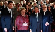 Intendants of the State Opera Juergen Flimm (R) and Matthias Schulz (L) pose with German Chancellor Angela Merkel (2L) and her husband Joachim Sauer ahead the re-opening of the State Opera in Berlin, on October 3, 2017.  AFP / John Macdougall