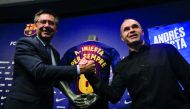 FC Barcelona captain Andres Iniesta (right) shakes hands with club President Josep Maria Bartomeu after announcing the agreement of a contract for life with the Catalan club, yesterday.