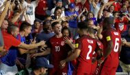 USA midfielder Christian Polisic (10) celebrates with teammates as he scores a goal against the Panama during the first half at Orlando City Stadium. Mandatory Credit: Kim Klement