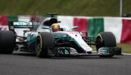 Mercedes' British driver Lewis Hamilton drives during the qualifying session of the Formula One Japanese Grand Prix at Suzuka on October 7, 2017. / AFP / Behrouz MEHRI
