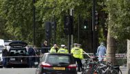 Police officers stand guard at the scene where several people have been injured after a car hit pedestrians near the Natural History Museum in London, England on October 7, 2017. ( Isabel Infantes - Anadolu Agency )