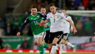 Germany’s Julian Draxler in action with Northern Ireland’s Oliver Norwood Action Images via Reuters/Jason Cairnduff
