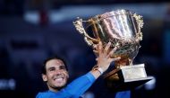 Rafael Nadal of Spain holds the trophy after winning the match against Nick Kyrgios of Australia. REUTERS/Jason Lee
