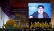 Lebanon's Hezbollah leader Sayyed Hassan Nasrallah addresses his supporters via a screen during a rally marking Al-Quds day in Beirut's southern suburbs, Lebanon June 23, 2017. REUTERS/Aziz Taher/File Photo
