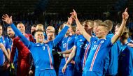 Iceland's players including Iceland's forward Johann Berg Gudmundsson (L) and Iceland's forward Alfred Finnbogason celebrate after the FIFA World Cup 2018 qualification football match between Iceland and Kosovo in Reykjavik, Iceland on October 9, 2017. AF