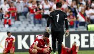 Syria's players react after losing. REUTERS/Steve Christo
