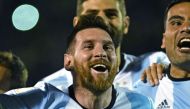 Argentina's Lionel Messi celebrates after defeating Ecuador and qualifying to the 2018 World Cup football tournament, in Quito, on October 10, 2017. / AFP / Juan Ruiz