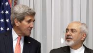 Secretary of State John Kerry (L) and Iran’s Foreign Minister Mohammad Javad Zarif pose before resuming talks in Lausanne, March 16, 2015. Reuters/Brian Snyder