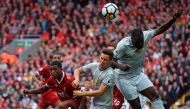 Liverpool's Dutch midfielder Georginio Wijnaldum (L) vies with Manchester United's Spanish midfielder Ander Herrera (C) and Manchester United's Belgian striker Romelu Lukaku (R) during the English Premier League football match between Liverpool and Manche