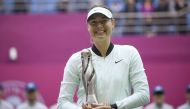 Maria Sharapova of Russia holds her trophy after winning her women's singles final match against Aryna Sabalenka of Belarus at the Tianjin Open tennis tournament in Tianjin on October 15, 2017. / AFP / WANG Zhao
