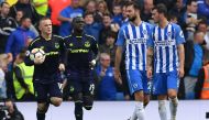 Everton's English striker Wayne Rooney (R) celebrates scoring a penalty during the English Premier League football match between Brighton and Hove Albion and Everton at the American Express Community Stadium in Brighton, southern England on October 15, 20