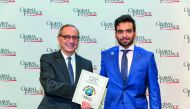 QNB official receiving ‘Best Bank in Qatar 2017’ award in Washington DC.