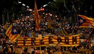  People hold a giant Estelada (pro-independence Catalan flag) reading 