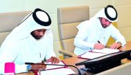 QU Student Services and Activities Director Abdulla Al Yafei and QPA Vice-President Abdulrahman Al Kuwari signing the MoU yesterday.