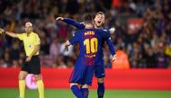Barcelona's forward Gerard Deulofeu (front) is congratulated by his teammate Barcelona's Argentinian forward Lionel Messi after scoring during the Spanish league football match FC Barcelona vs Malaga CF at the Camp Nou stadium in Barcelona on October 21, 