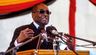 Zimbabwe President Robert Mugabe speaks during the burial of two national heroines Victoria Chitepo and Vivian Mwashita at the National Heroes Acre on April 13, 2016 in Harare AFP / Jekesai Njikizana