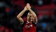 Liverpool's Jordan Henderson applauds fans after the match REUTERS/Eddie Keogh